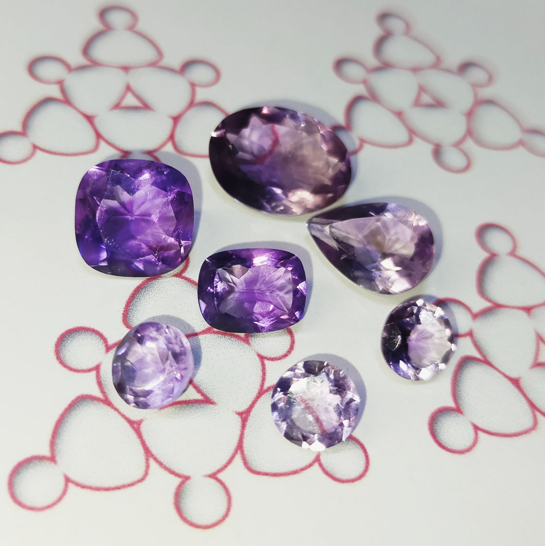 Amethyst faceted loose stones. Various shapes and sizes.