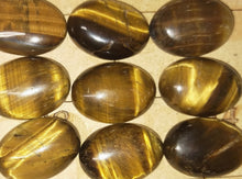 Load image into Gallery viewer, Tigers eye oval cabochons. Various sizes
